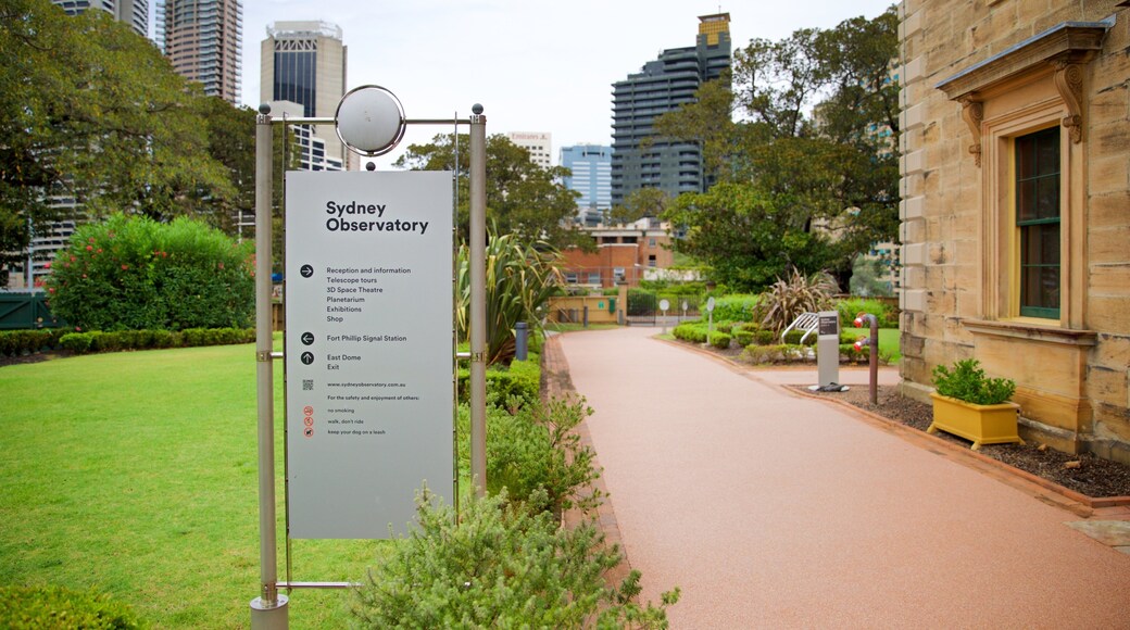 Sydney Observatory featuring a park and signage