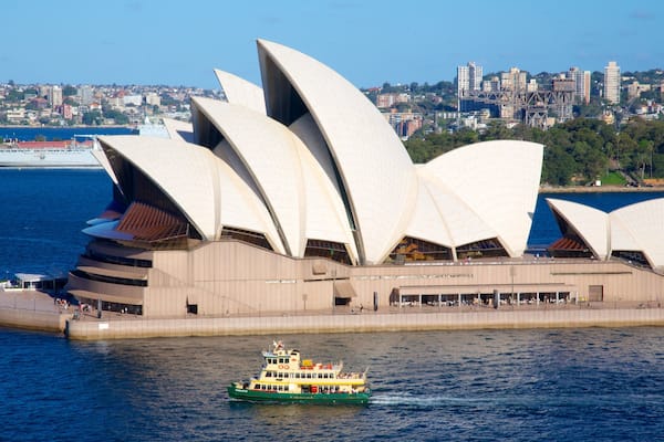 Sydney Opera House showing boating, music and a bay or harbour