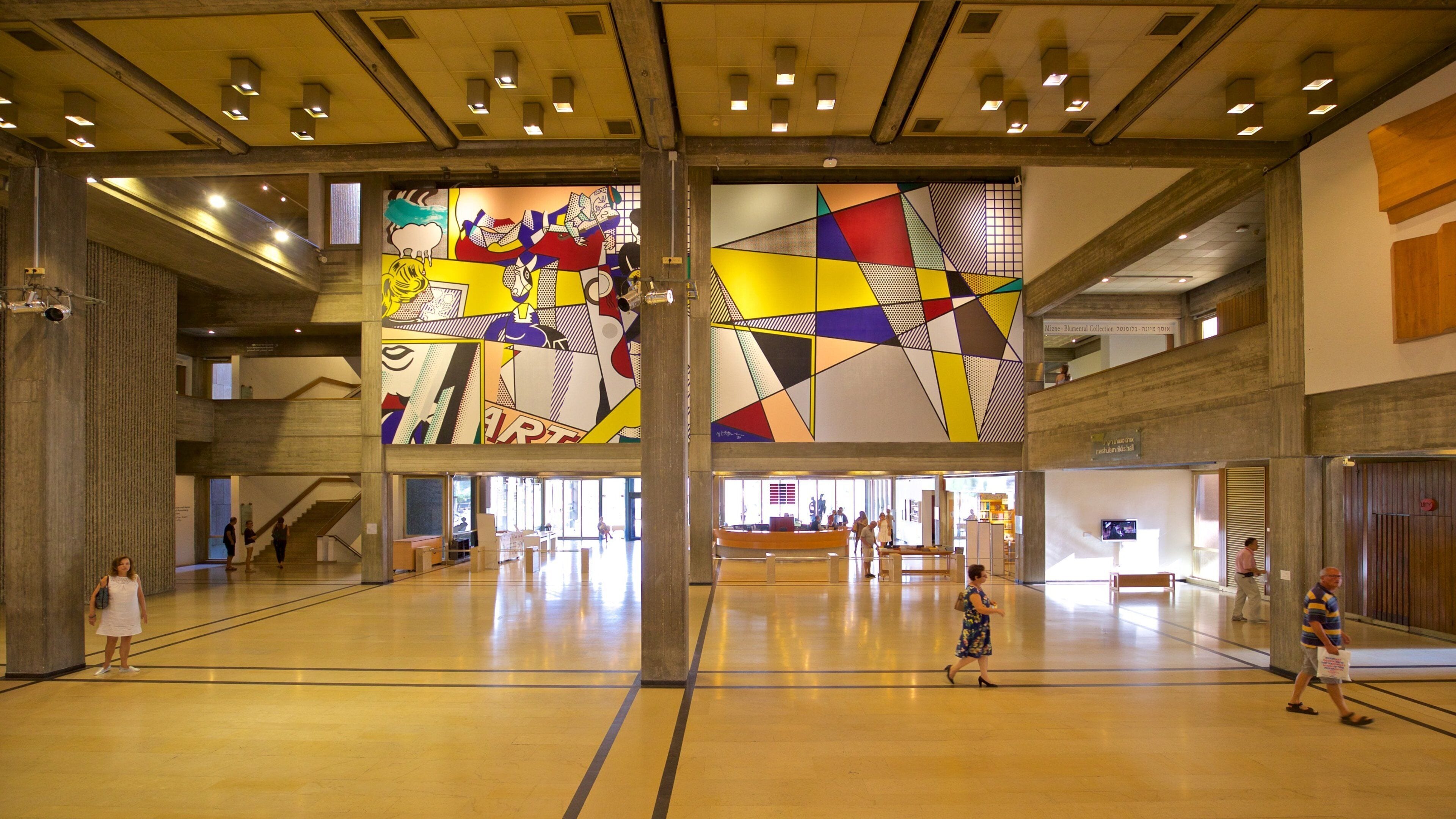 Tel Aviv Museum of Art featuring interior views and art as well as a small group of people