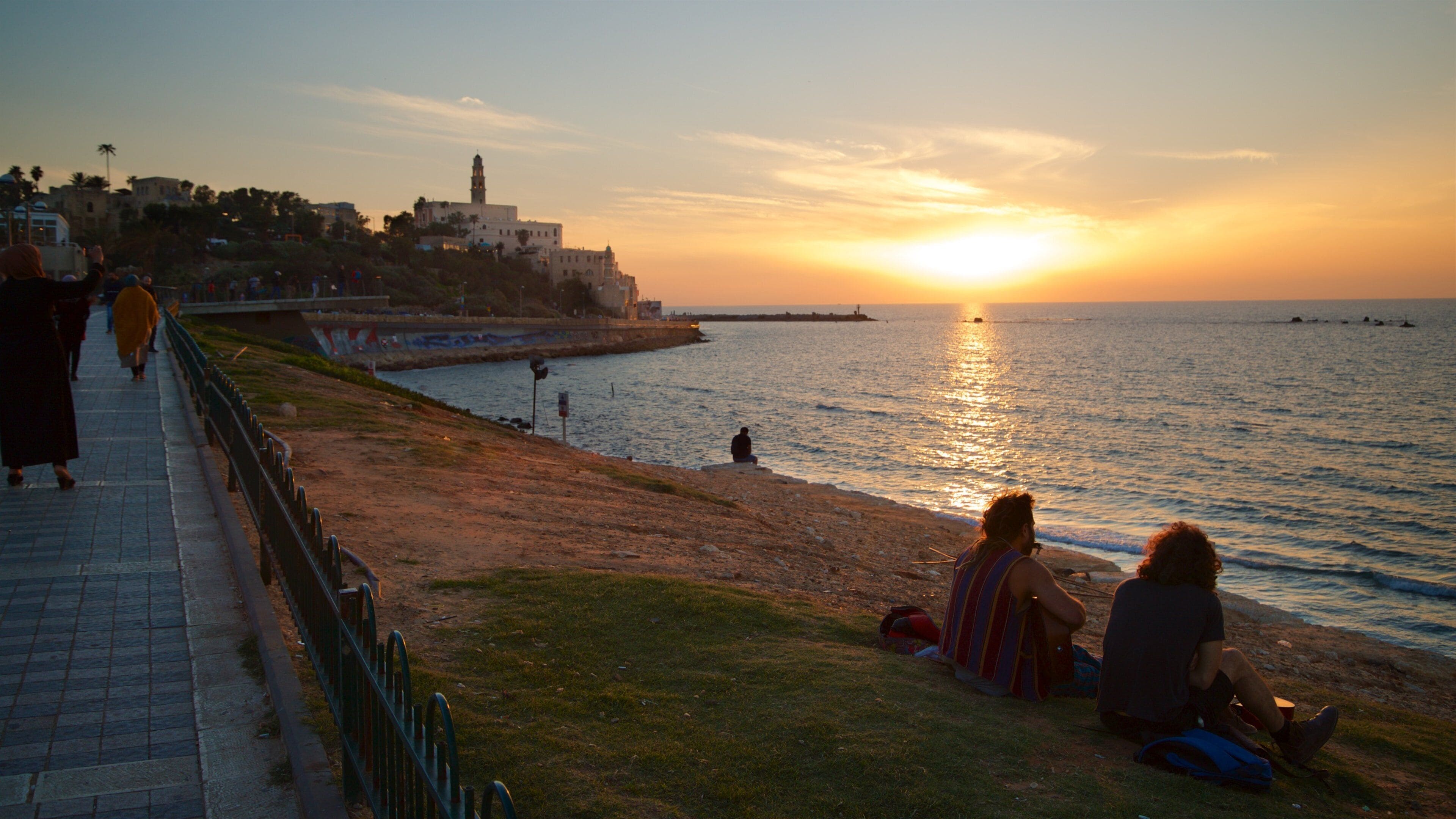 St. Peter\'s Church featuring a sunset and general coastal views as well as a couple
