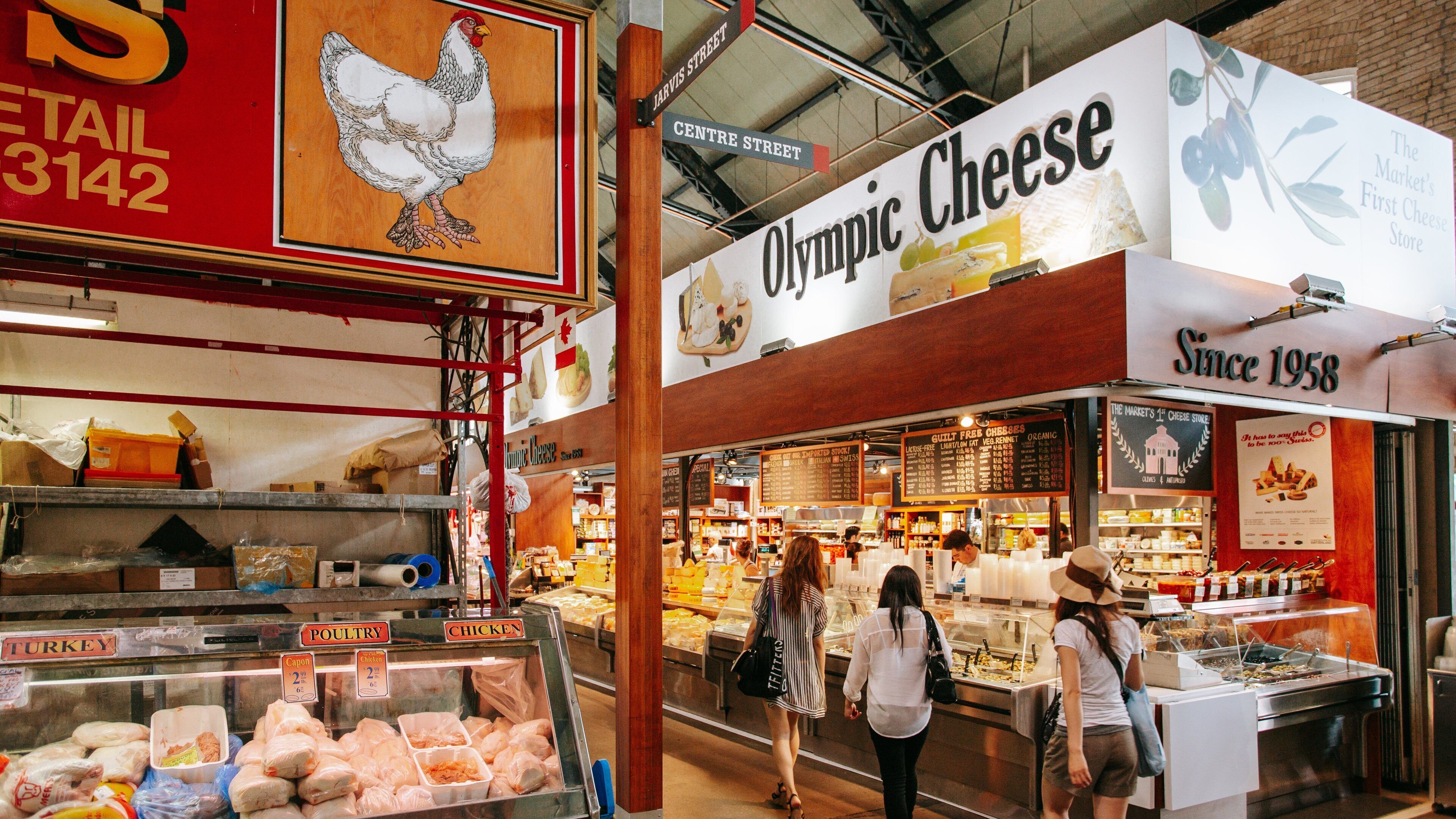 St. Lawrence Market featuring signage, markets and interior views
