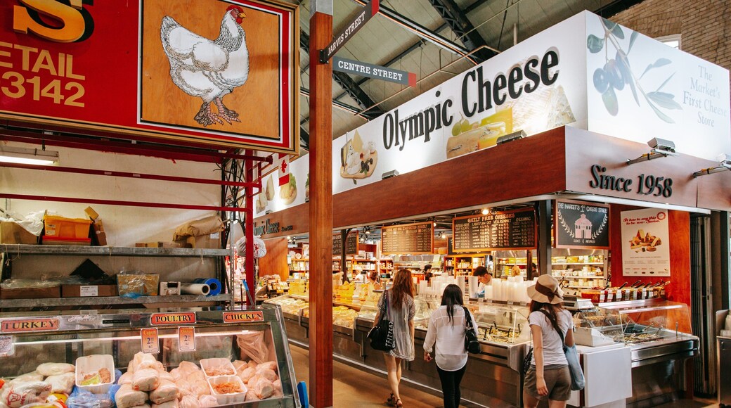 St. Lawrence Market featuring signage, markets and interior views