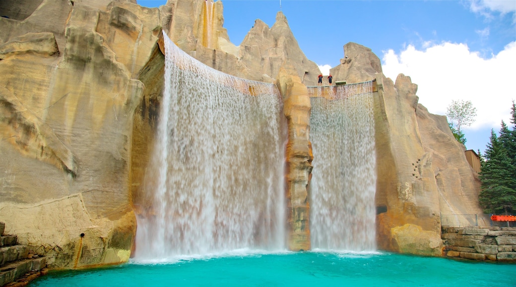 CN Tower showing a pond and a waterfall