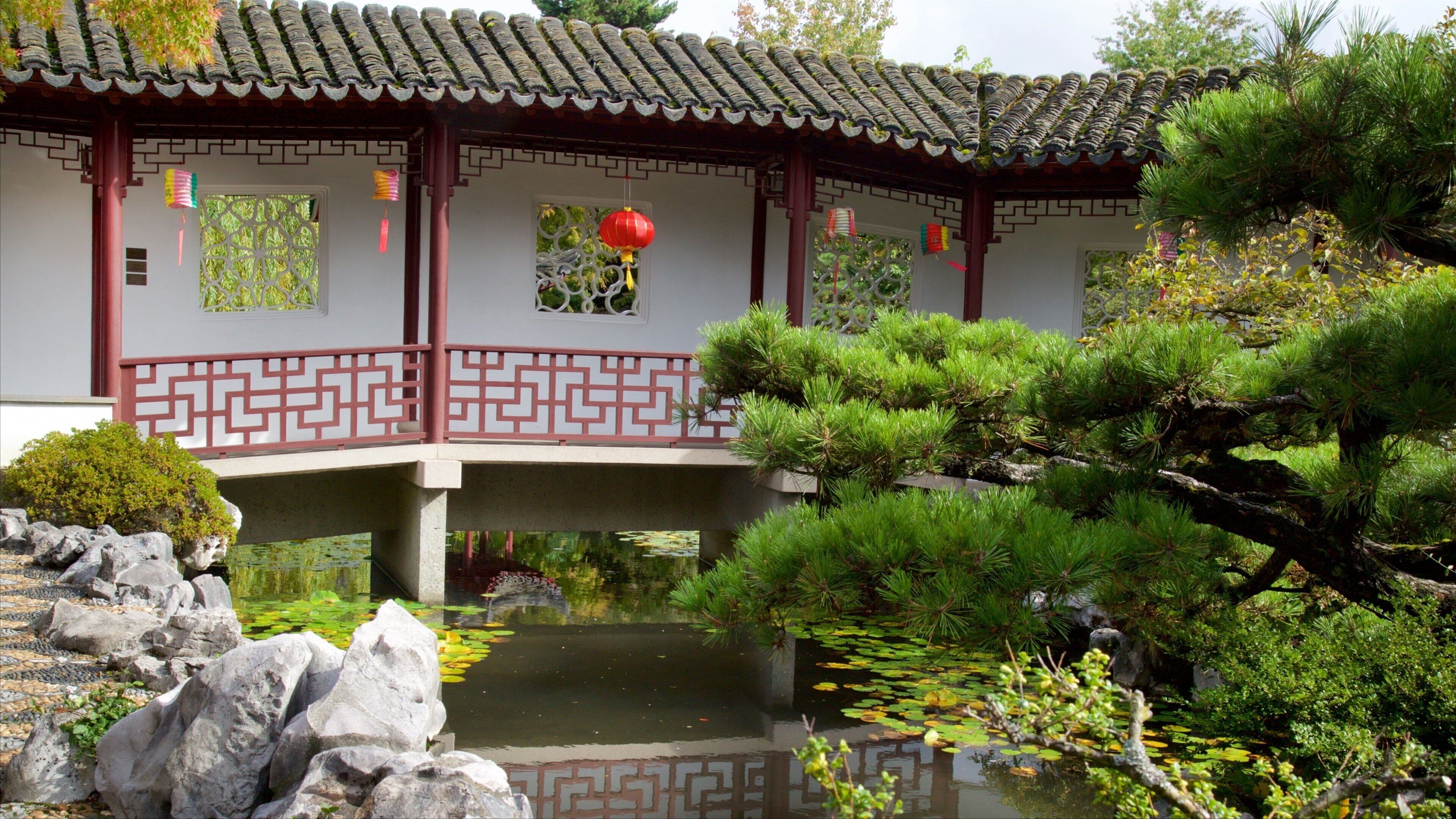 Dr. Sun Yat-Sen Classical Chinese Garden showing a pond, a garden and a temple or place of worship