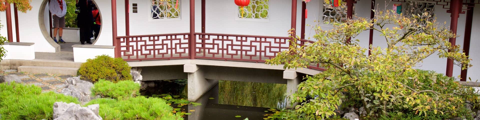 Dr. Sun Yat-Sen Classical Chinese Garden featuring a park, a pond and a temple or place of worship