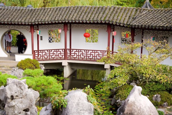 Dr. Sun Yat-Sen Classical Chinese Garden featuring a park, a pond and a temple or place of worship