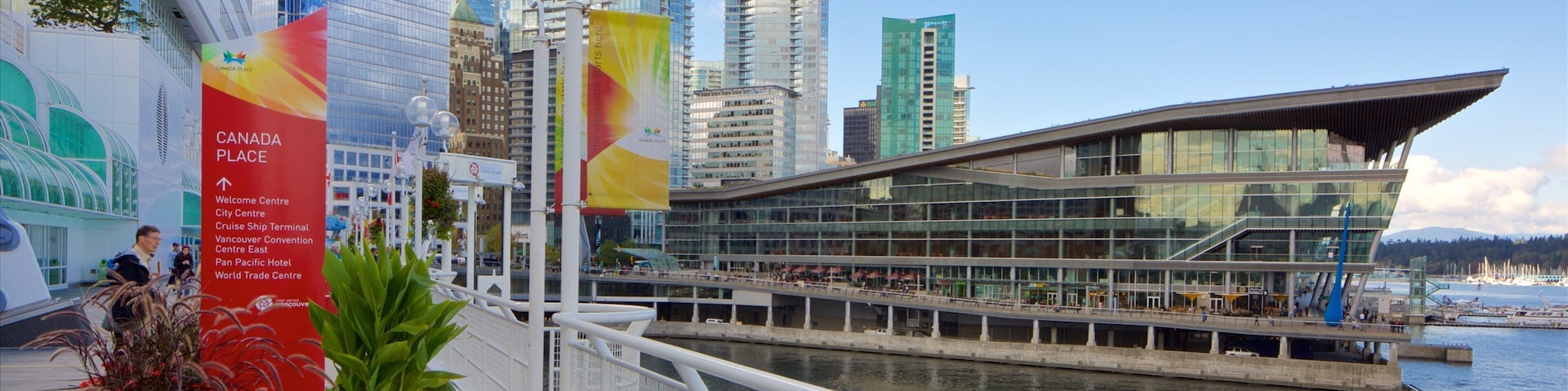 Canada Place which includes modern architecture, a city and a bay or harbor