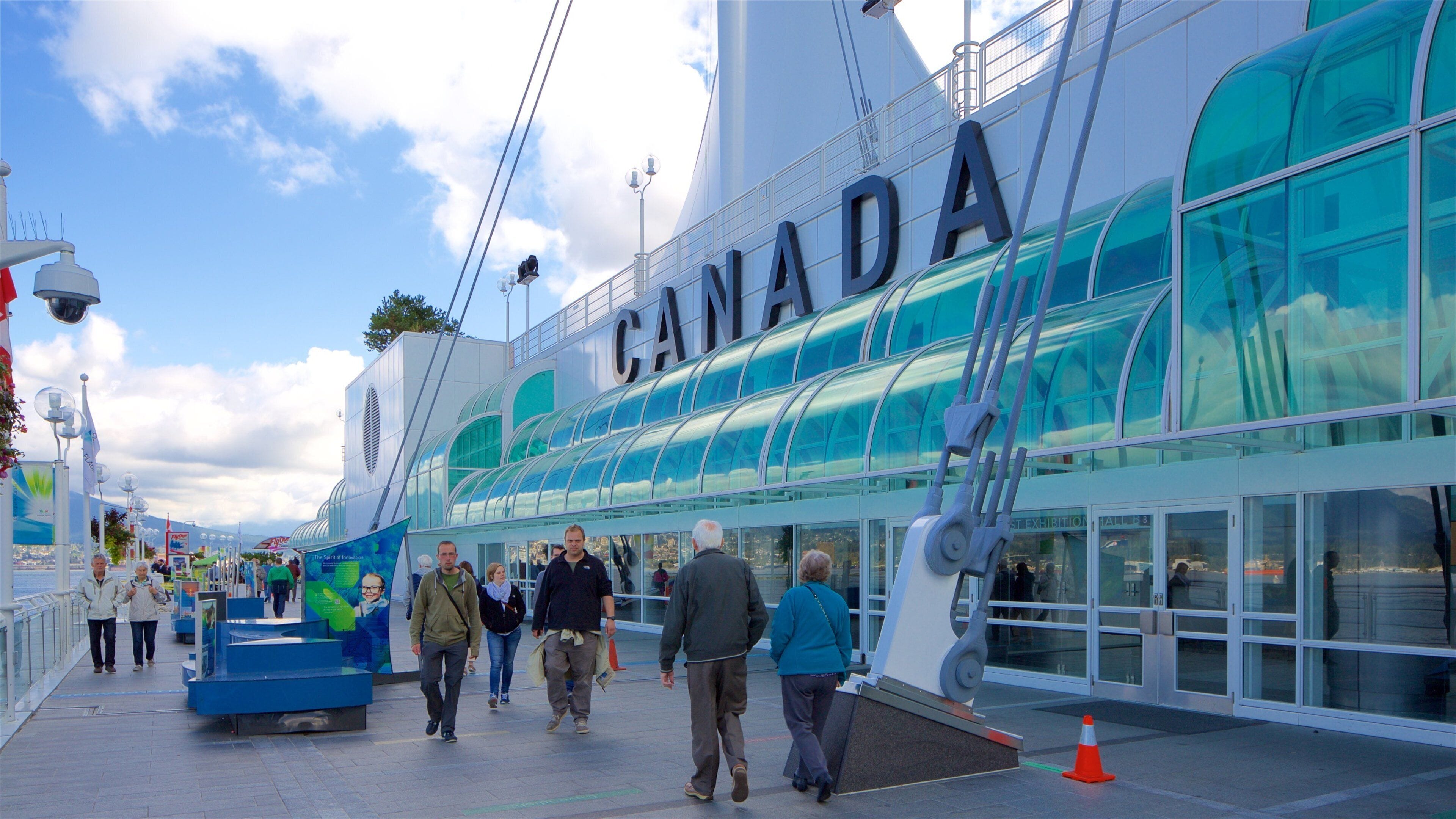 Canada Place featuring modern architecture as well as a small group of people