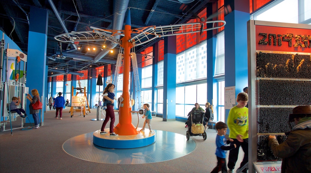 TELUS World of Science which includes interior views as well as a small group of people