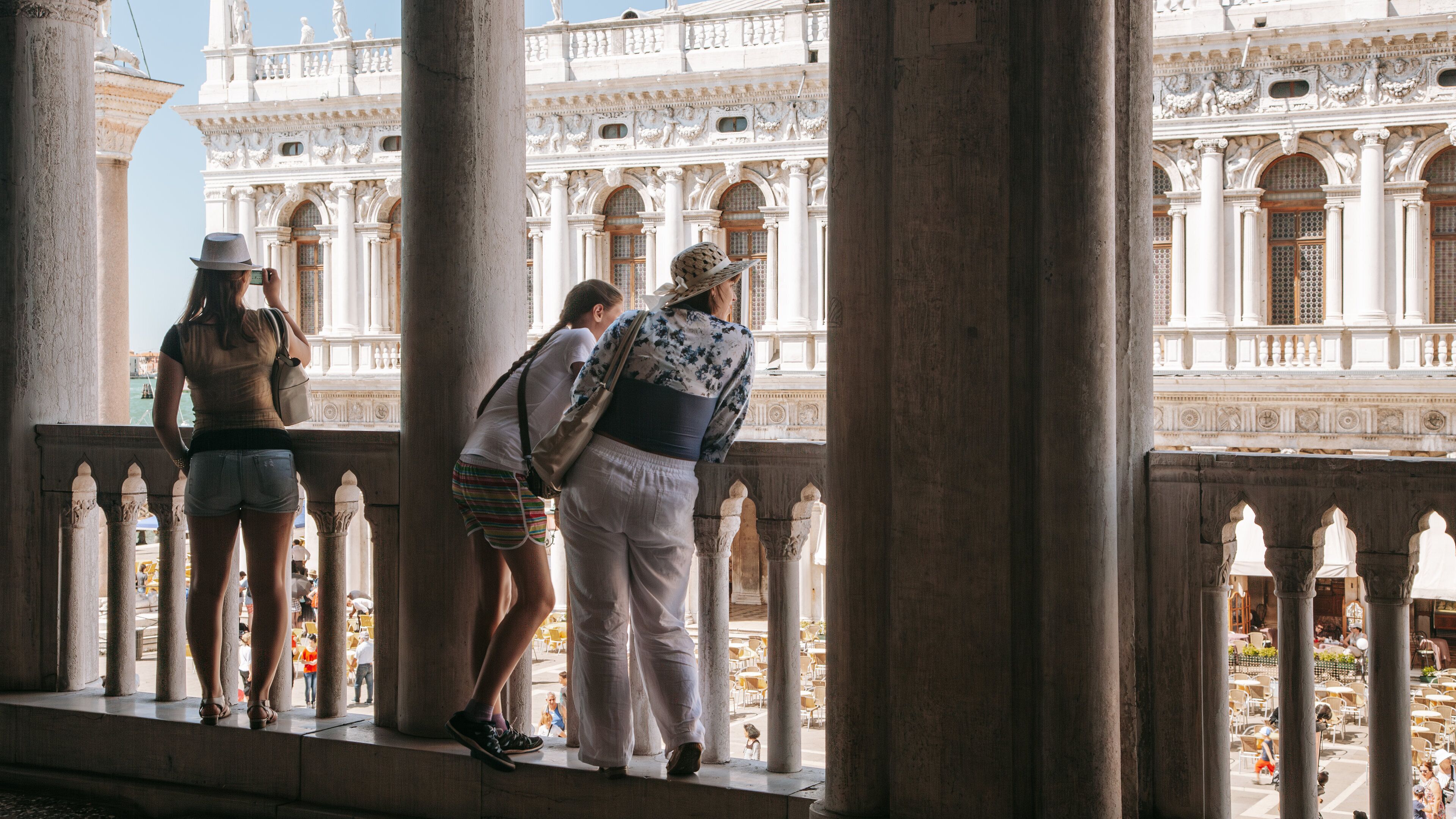 Doge\'s Palace featuring views as well as a small group of people
