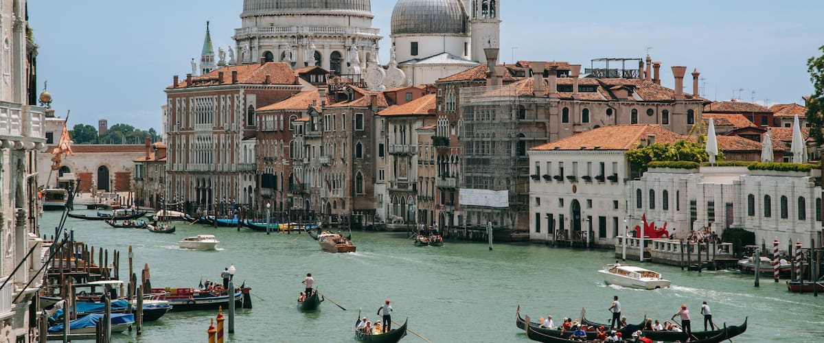 Teatro La Fenice featuring a city, kayaking or canoeing and a river or creek
