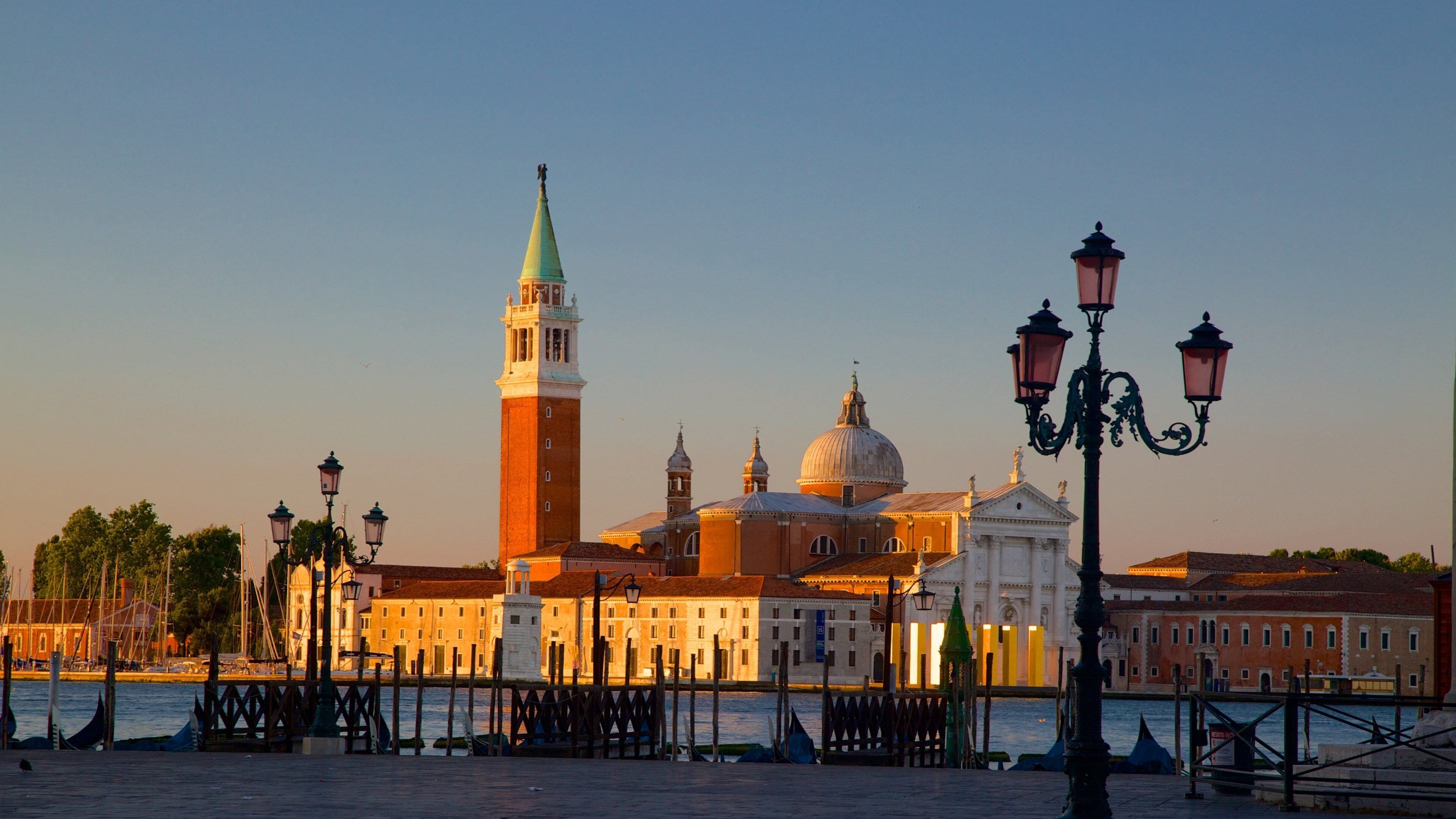 St. Mark\'s Square which includes a sunset, heritage architecture and a city