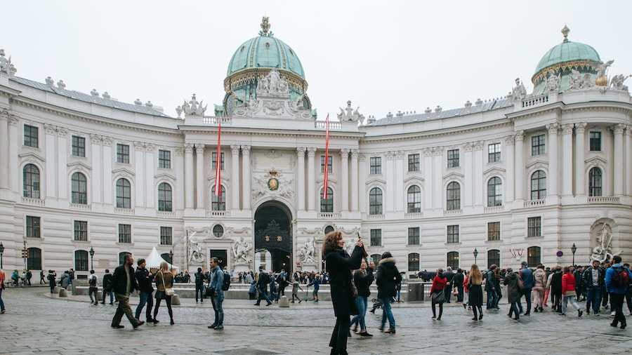 Hofburg Imperial Palace featuring heritage architecture, street scenes and a square or plaza