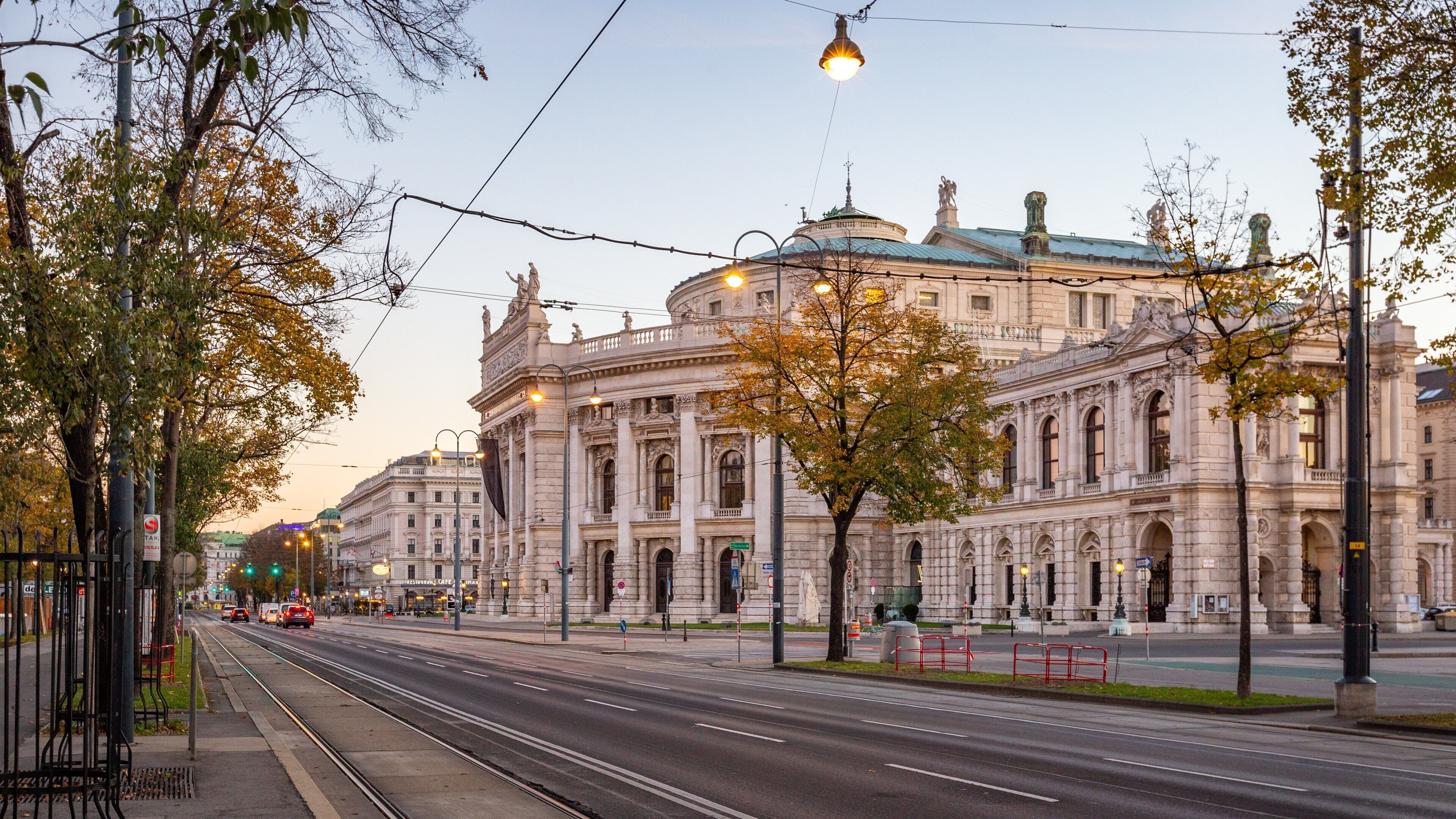 Burgtheater which includes a sunset and heritage architecture