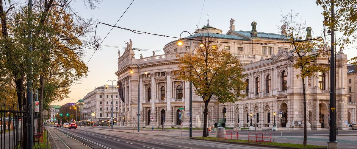 Burgtheater which includes a sunset and heritage architecture