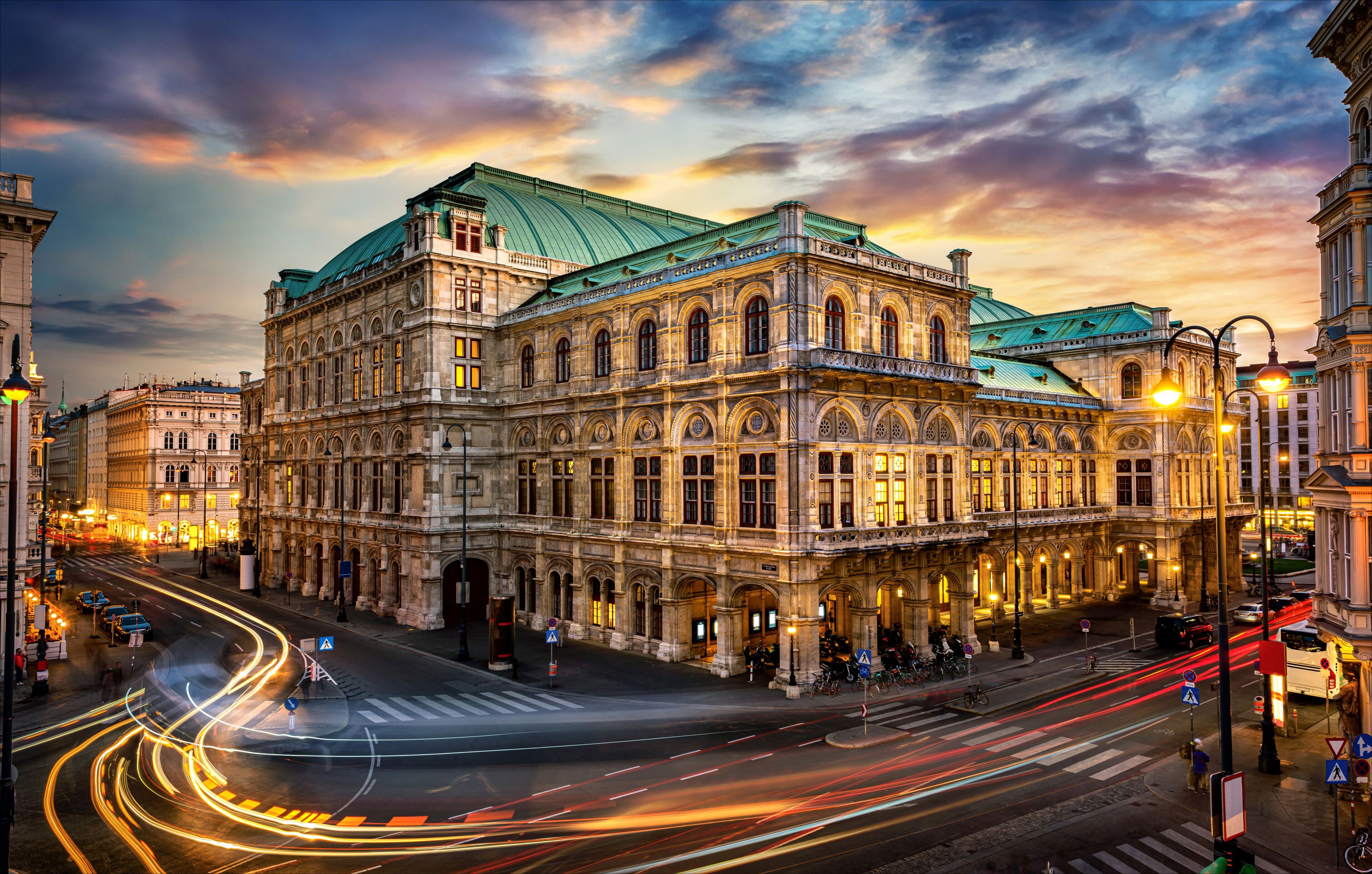 Vienna State Opera. Veinna, Austria. Evening view. The historic opera house is a symbol and landmark of the city of Vienna.  Panoramic view, long exposure.