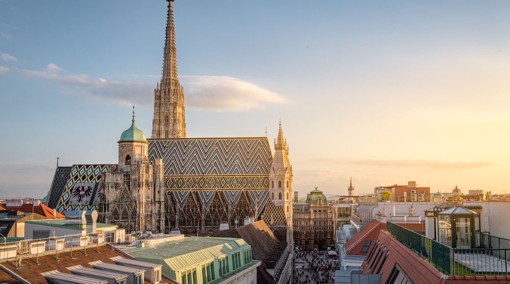 A historic cathedral with a tall spire and a large, patterned facade.