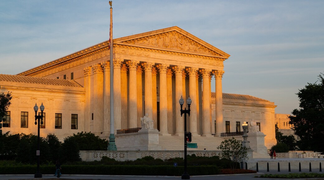 Supreme Court of the United States which includes an administrative buidling, heritage architecture and a sunset