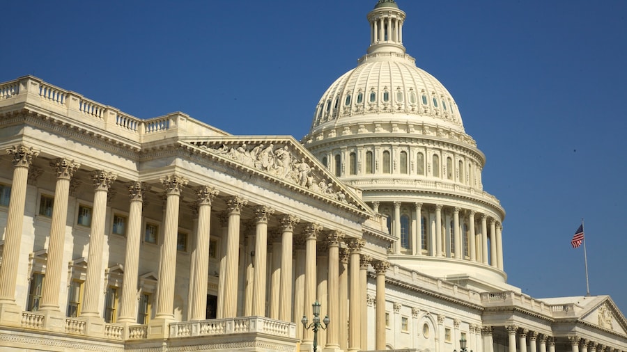 United States Capitol building showcasing neoclassical architecture under clear blue skies in Washington, DC