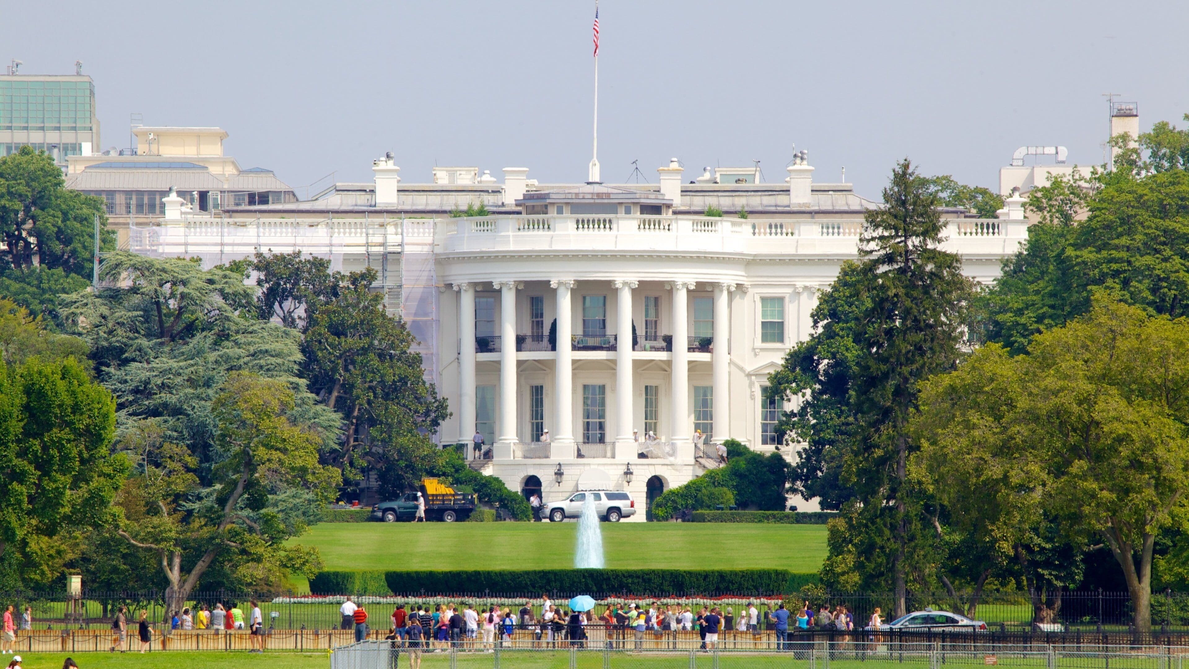White House showing an administrative buidling, a city and a park