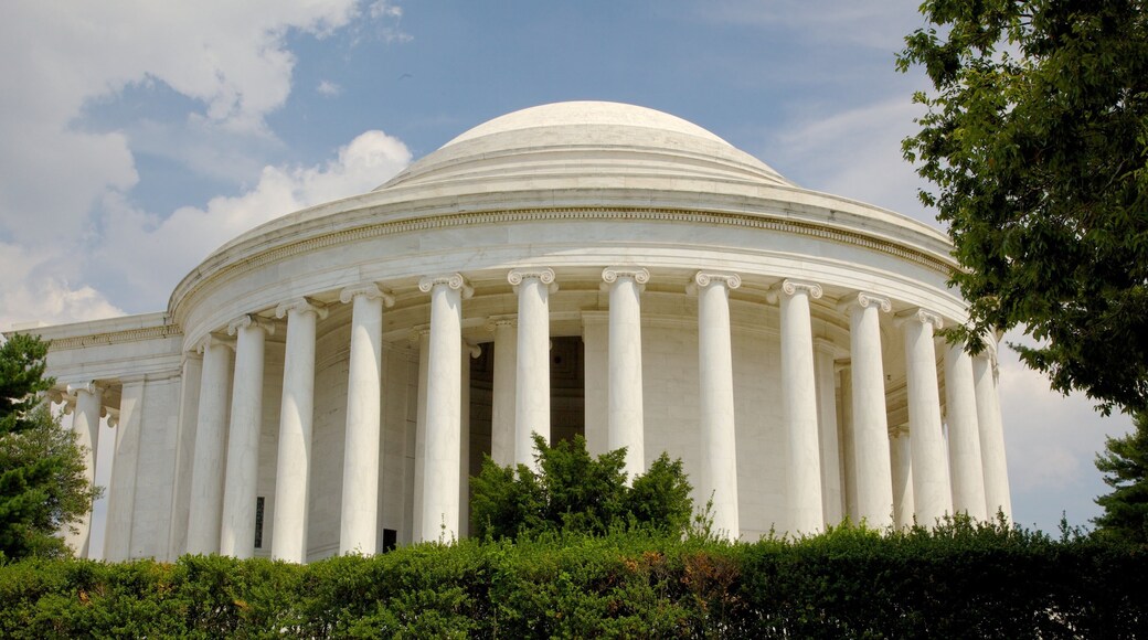 Jefferson Memorial surrounded by green trees on a sunny day in Washington D.C