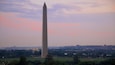 Washington Monument stands tall in the evening light over the National Mall in Washington, United States