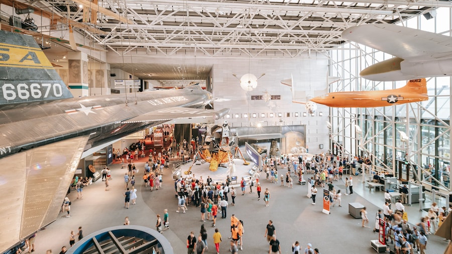 National Air and Space Museum featuring interior views as well as a large group of people