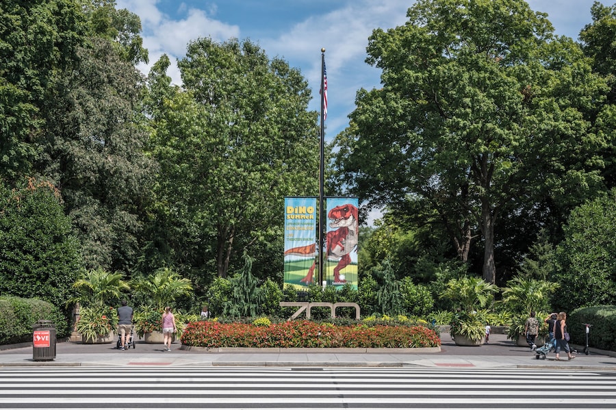Entrance to the National Zoo with colorful banners and greenery in Washington, D.C.