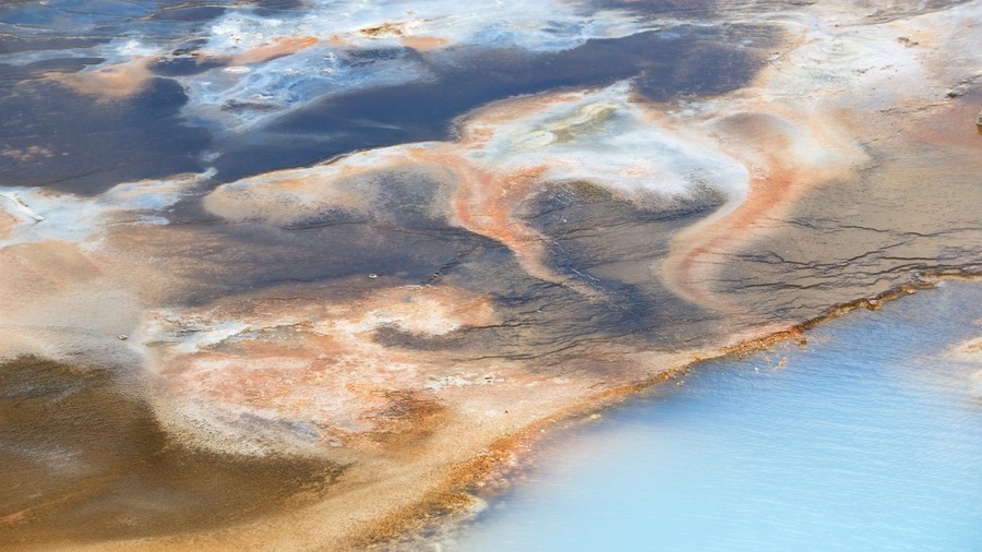 Norris Geyser Basin featuring a hot spring and landscape views