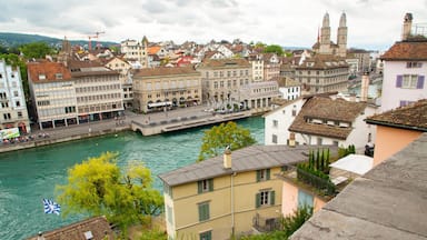 A river with buildings and a bridge in a European city.
