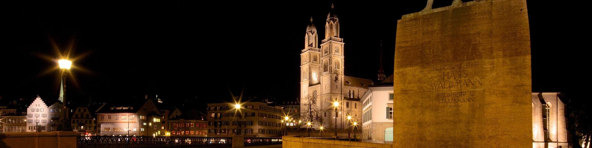 Grossmuenster showing a monument, a city and night scenes