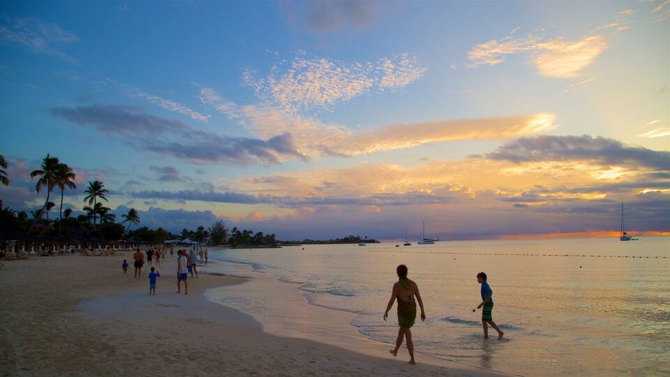 Dickenson Bay Beach showing a sandy beach, a sunset and general coastal views
