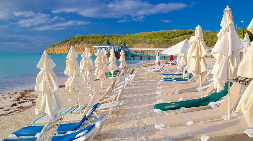 Dickenson Bay Beach which includes rugged coastline, tropical scenes and general coastal views