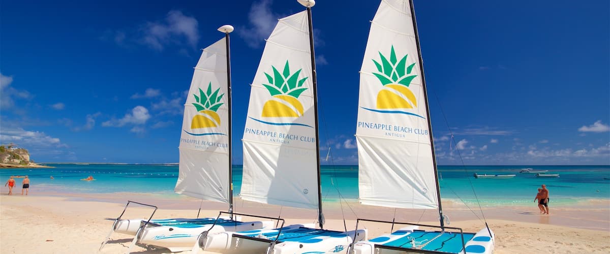 Antigua featuring a sandy beach, signage and general coastal views