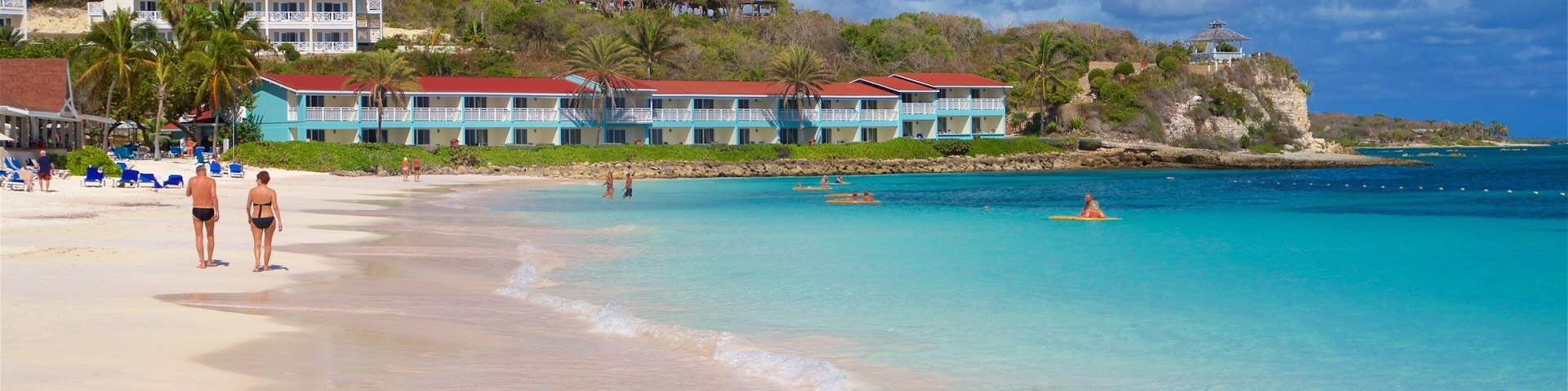 Long Bay showing a beach, a coastal town and general coastal views