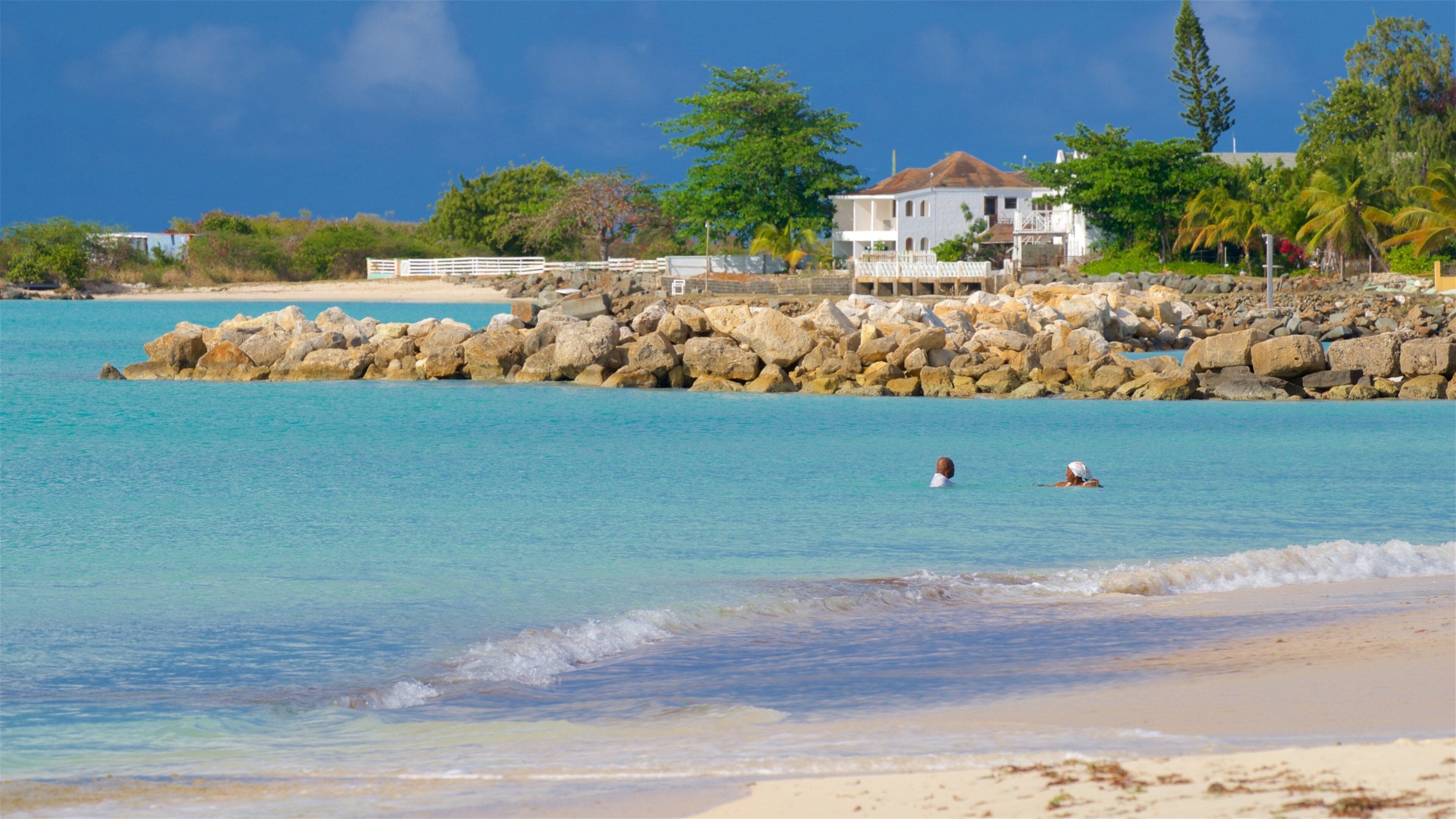 Runaway Bay Beach featuring tropical scenes, a beach and general coastal views