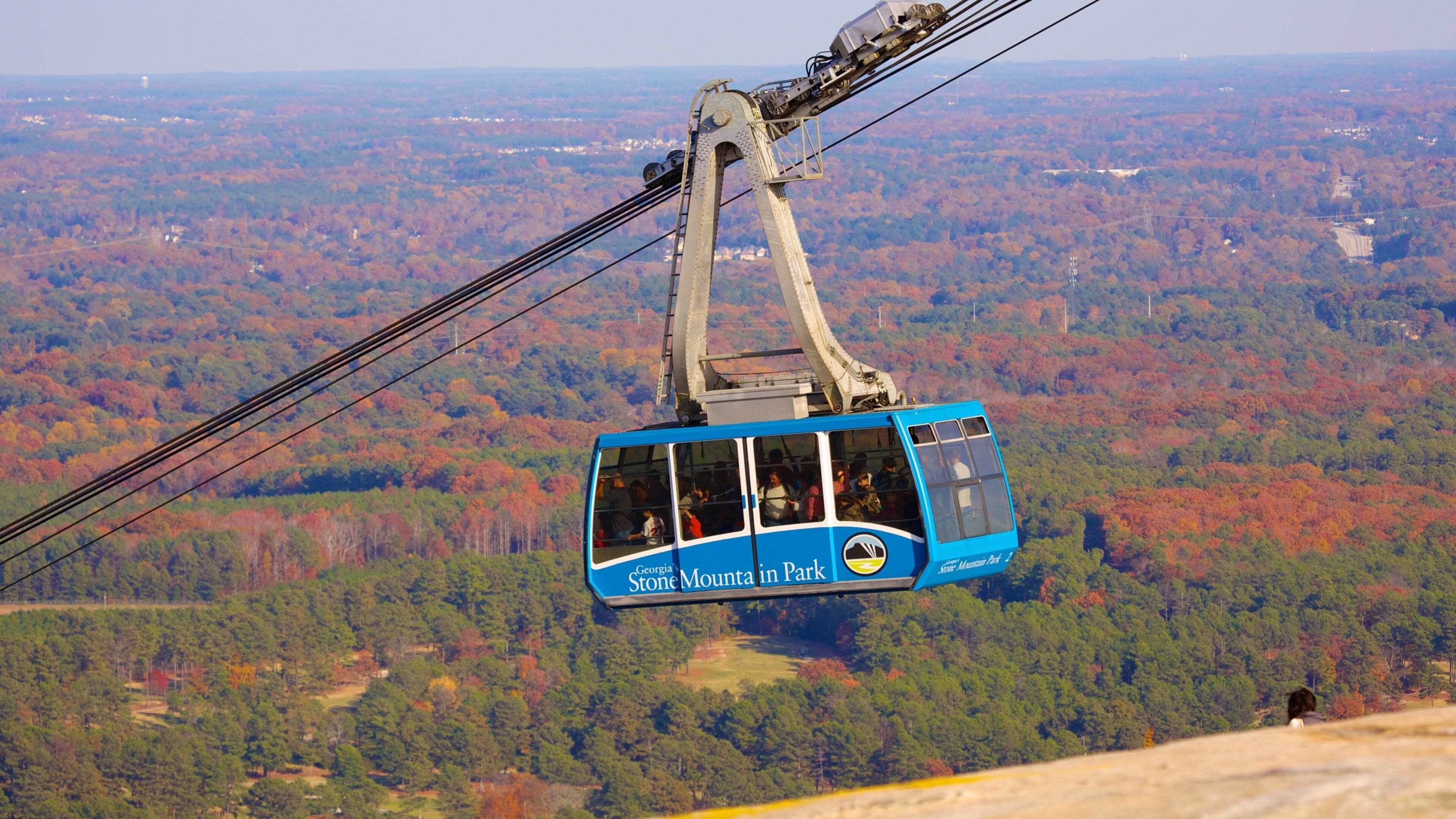 Scenic cable car ride offers stunning views of Stone Mountain Park in Georgia during autumn