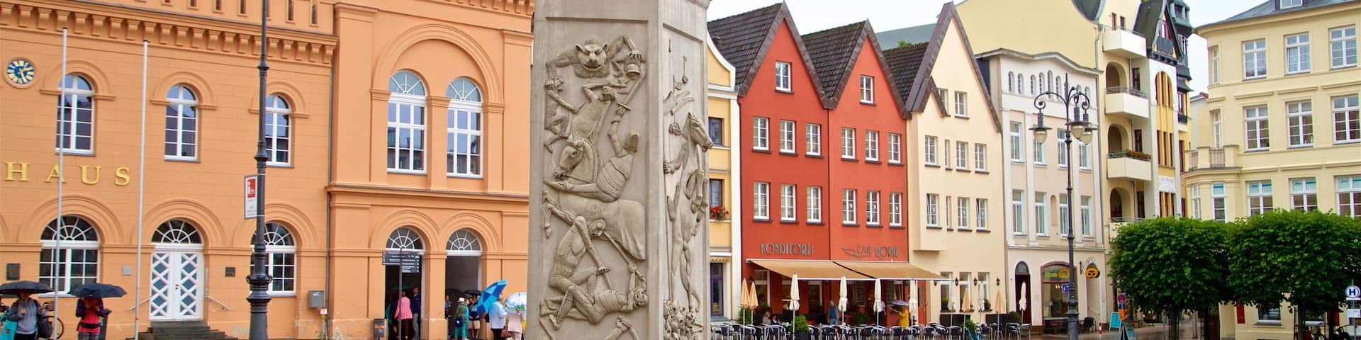 Schwerin showing a statue or sculpture, a city and a square or plaza