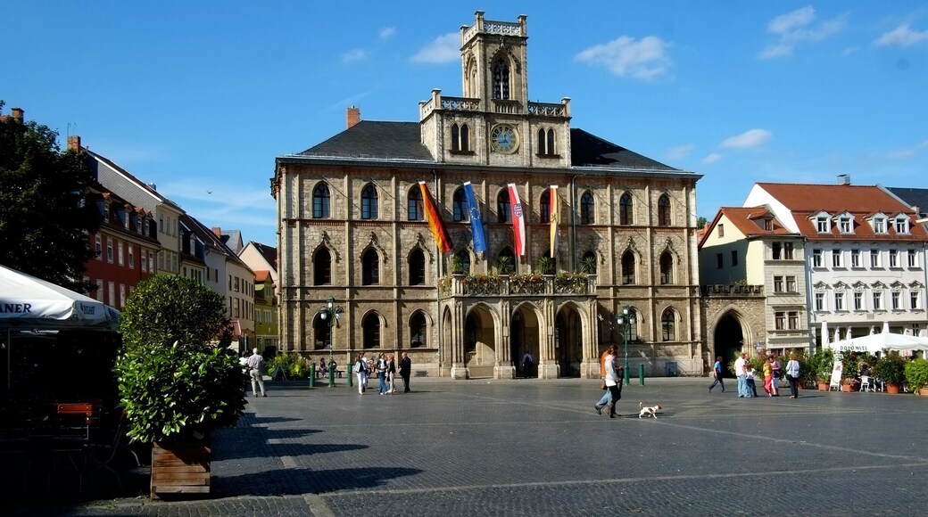 The Weimar Town Hall is located in the centre of Weimar on the west side of the 60 x 60 metre market square. The three-storey building in neo-Gothic style with a representative balcony and bell tower is one of the landmarks of Weimar.