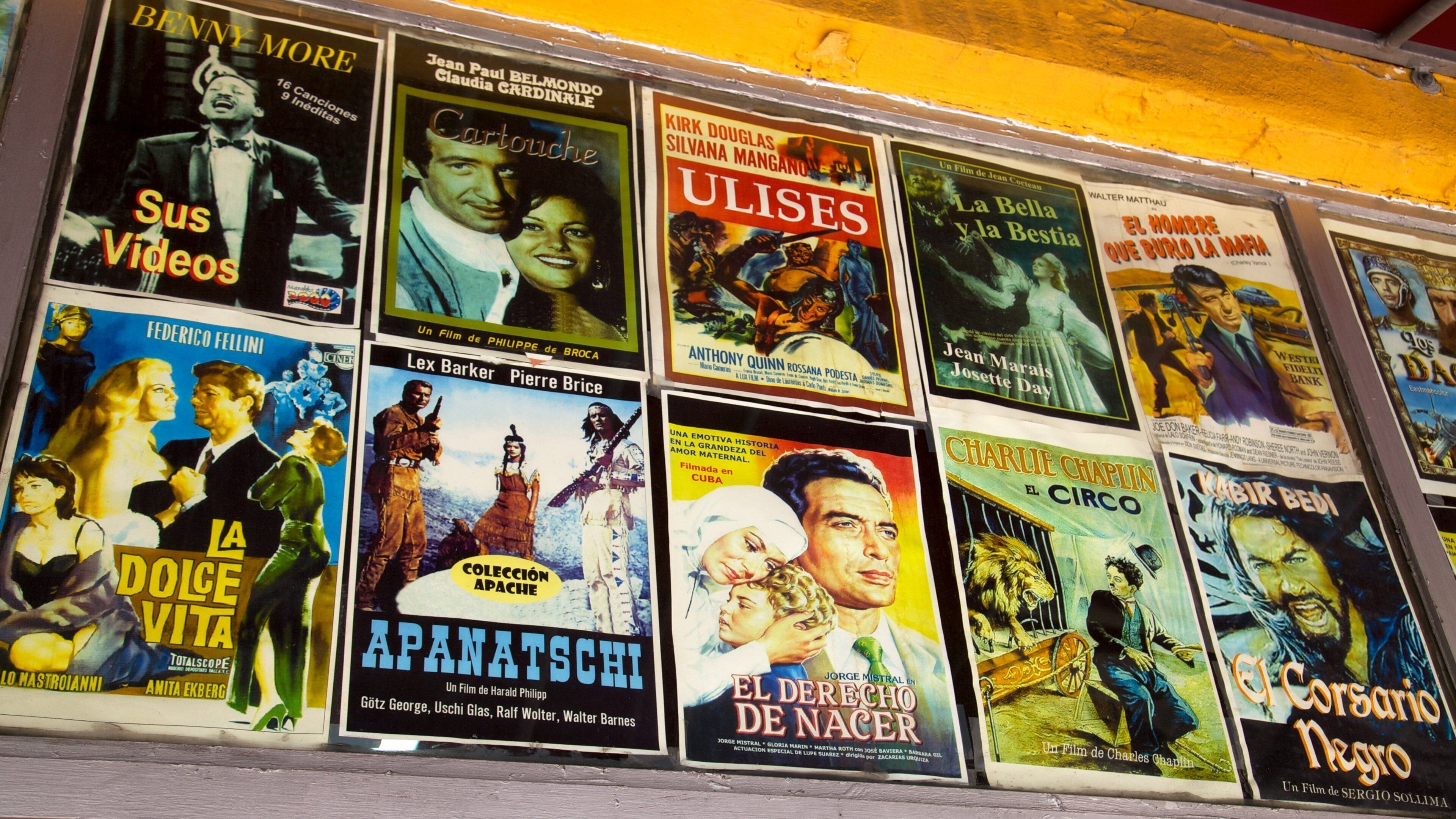 Colorful movie posters display vibrant culture in Little Havana, Miami, showcasing Latin American cinema and art