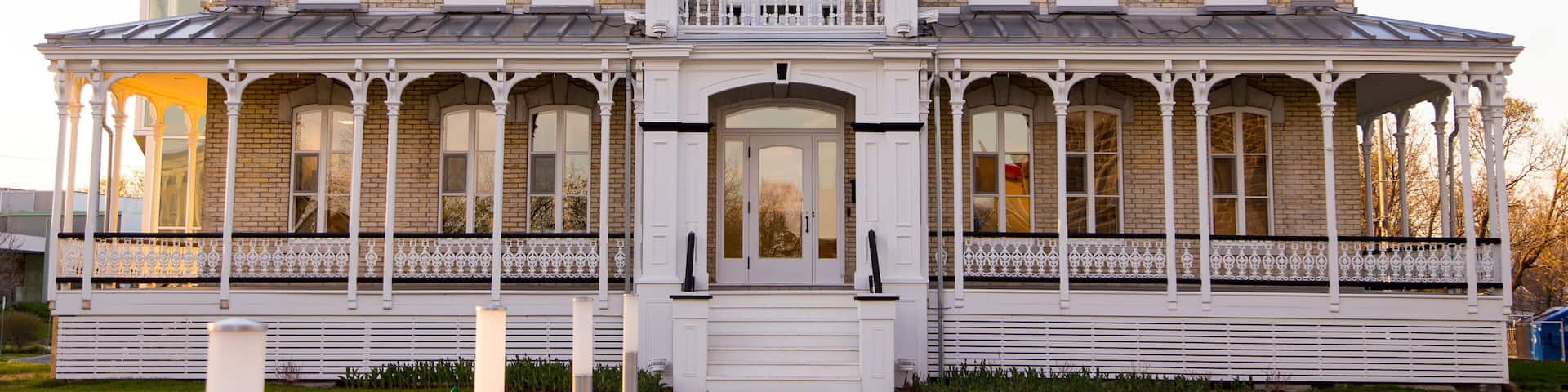 Horizontal frontal view of the 1893 italianate two story Notre-Dame-de-l’Annonciation presbytery in L’Ancienne-Lorette, small town in the vicinity of Quebec City, Quebec, Canada