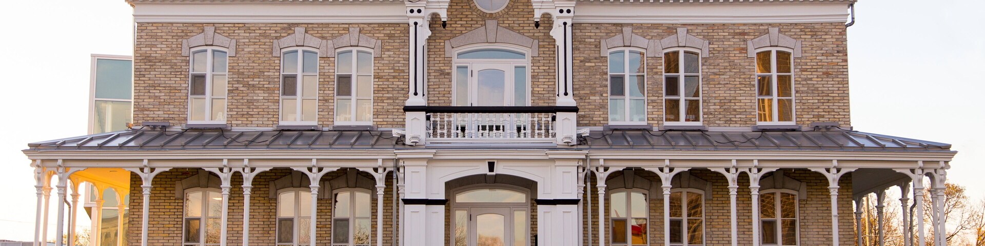 Horizontal frontal view of the 1893 italianate two story Notre-Dame-de-l’Annonciation presbytery in L’Ancienne-Lorette, small town in the vicinity of Quebec City, Quebec, Canada