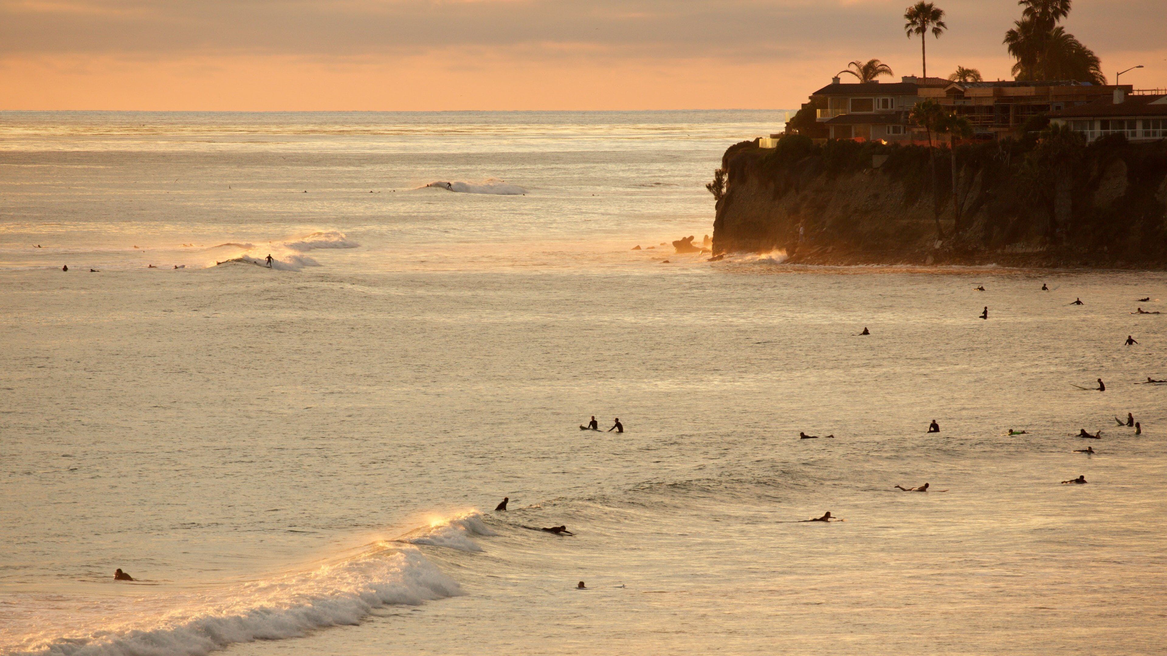 Pacific Beach Park featuring surfing, a sunset and general coastal views