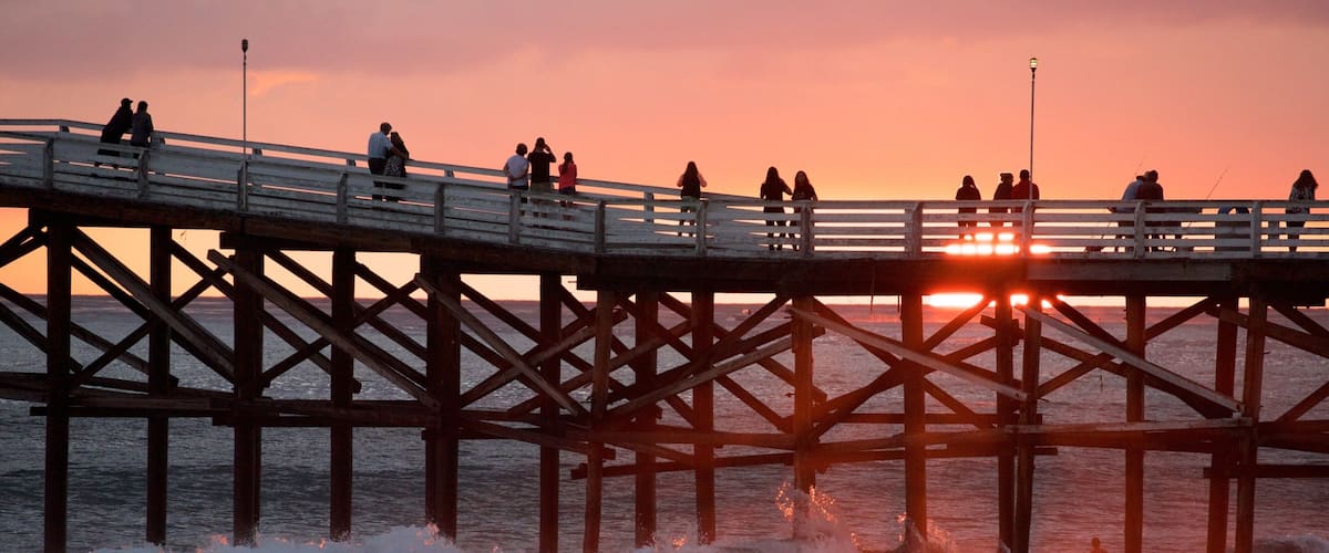 Pacific Beach Park featuring a sandy beach and a sunset