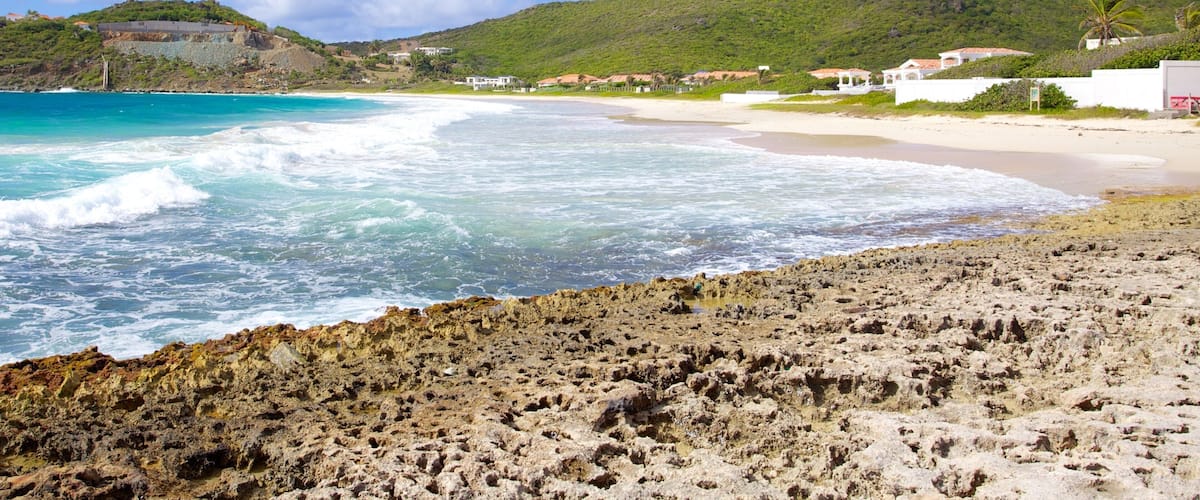 Guana Bay Beach which includes a coastal town, landscape views and a sandy beach
