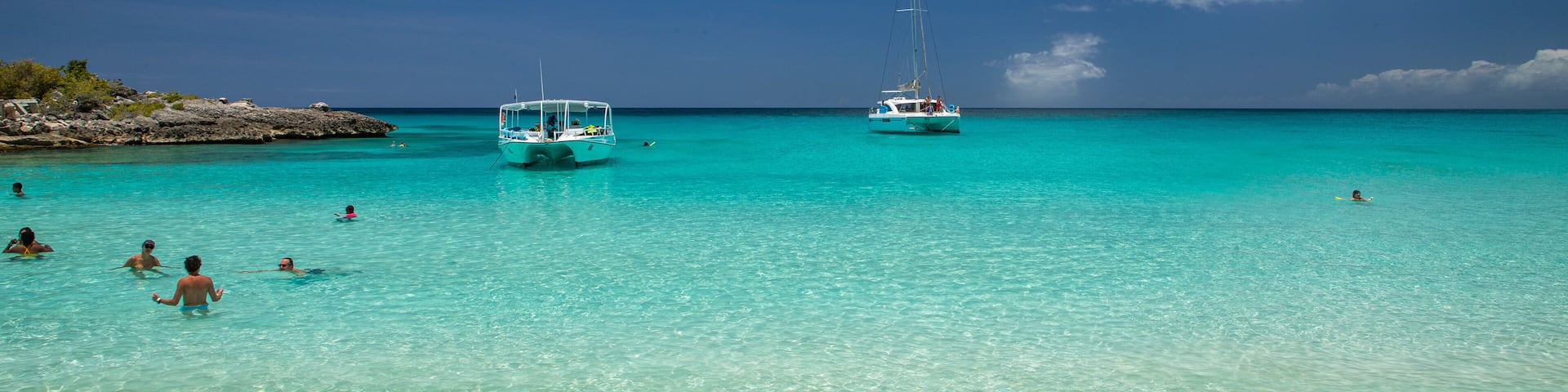 Mullet Bay Beach which includes tropical scenes, general coastal views and a beach
