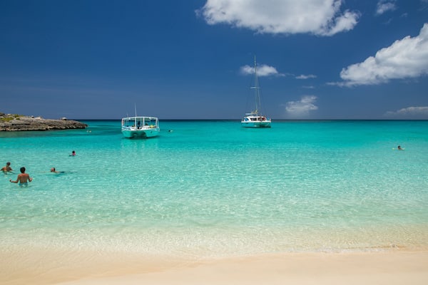 Mullet Bay Beach which includes tropical scenes, general coastal views and a beach