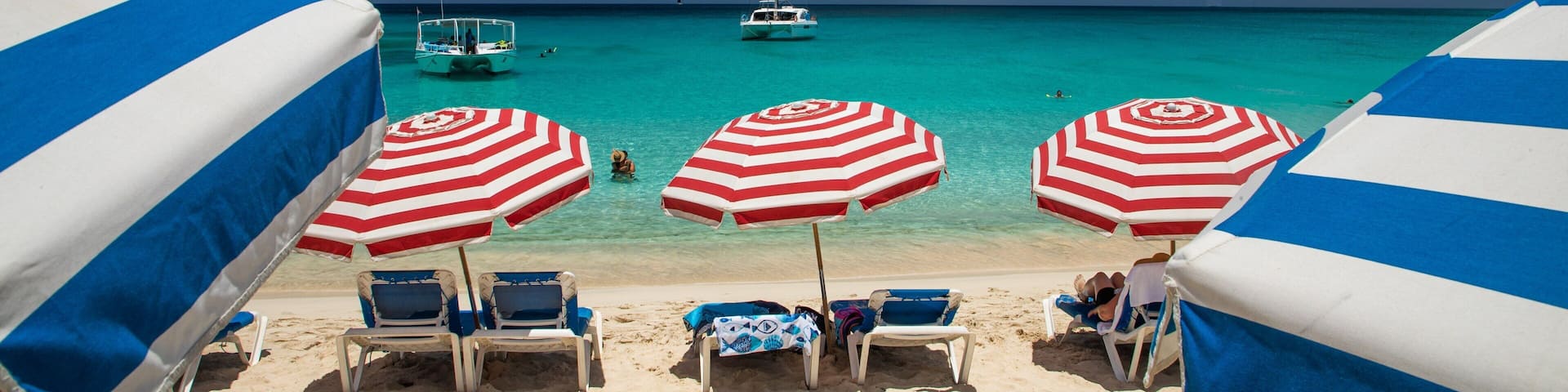 Mullet Bay Beach which includes a beach, tropical scenes and general coastal views