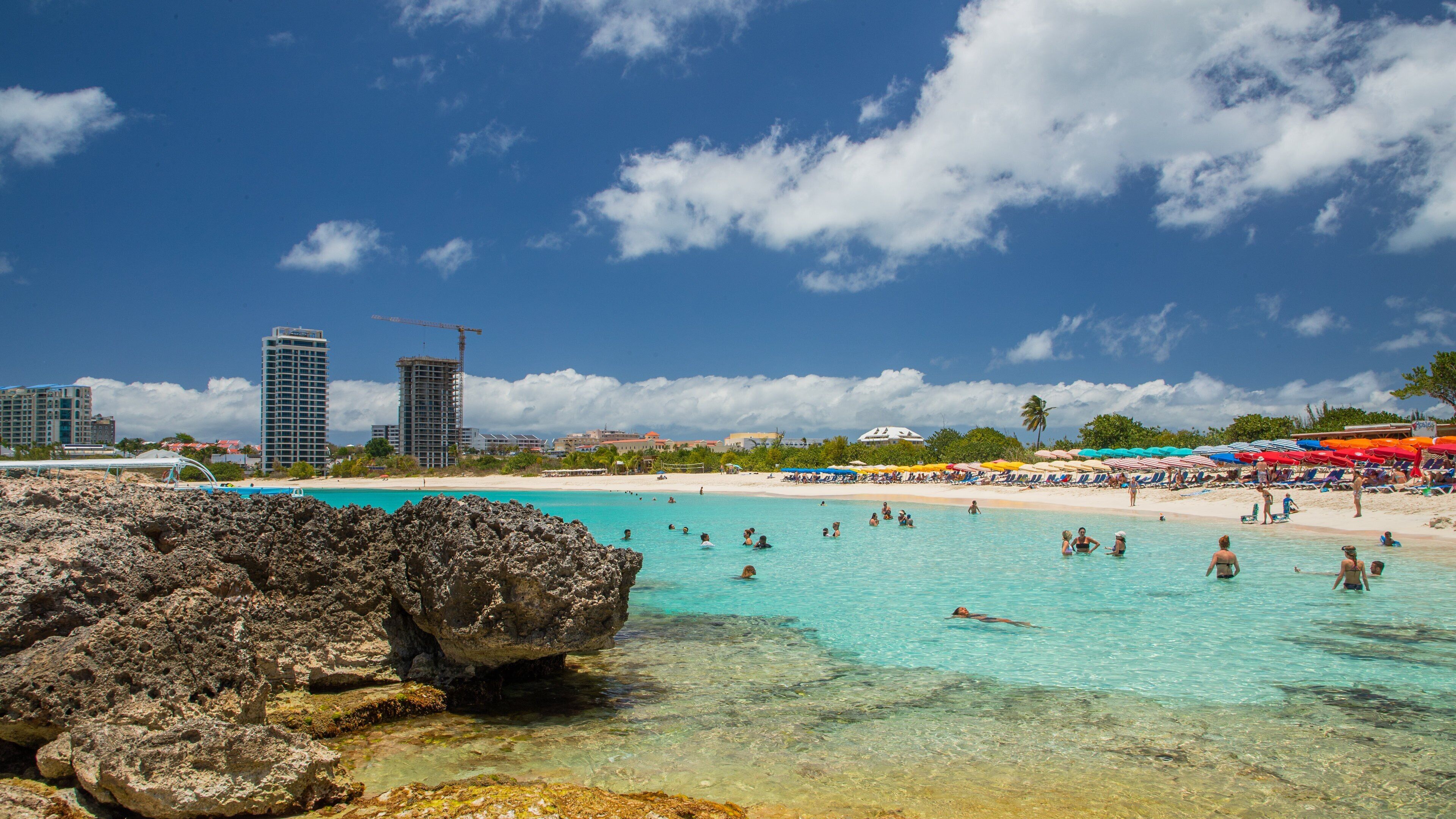 Mullet Bay Beach which includes a sandy beach, swimming and general coastal views