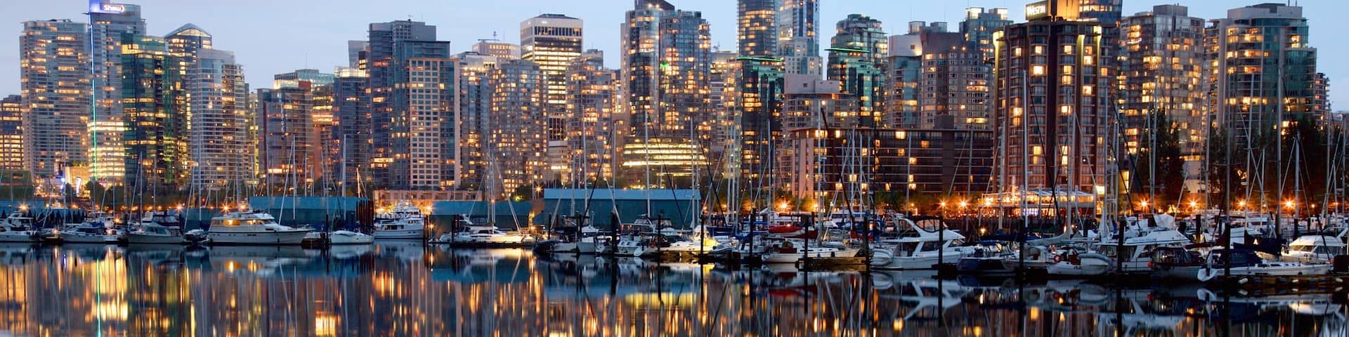 Stanley Park featuring a bay or harbor, a city and a skyscraper